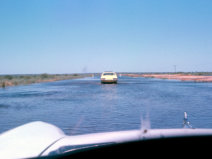 Flooded Hwy east of Wilcannia on transfer to Newcastle 38C that day